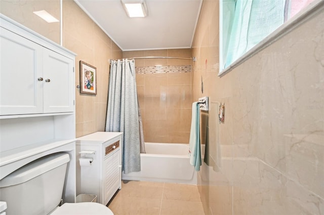 bathroom featuring shower / bath combo, tile walls, toilet, and tile patterned floors