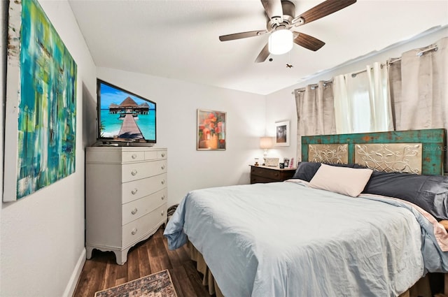 bedroom featuring dark hardwood / wood-style flooring and ceiling fan