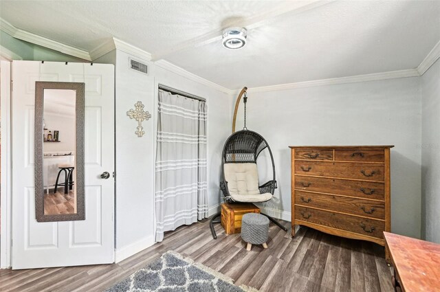 bedroom featuring ornamental molding, hardwood / wood-style floors, and ceiling fan