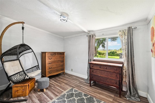 sitting room with ornamental molding, a textured ceiling, and hardwood / wood-style floors