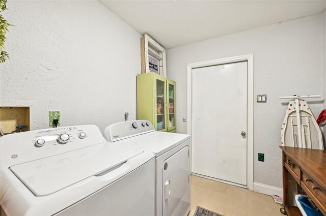 laundry room featuring washing machine and dryer