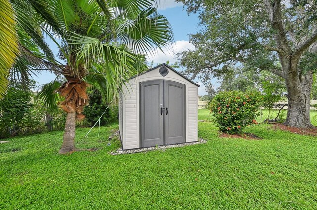 view of outdoor structure with a lawn