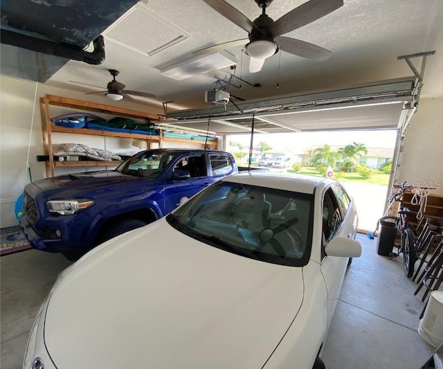 garage featuring a garage door opener and ceiling fan