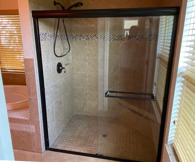 bathroom featuring tile patterned floors and plus walk in shower