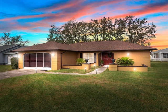 ranch-style home featuring a lawn