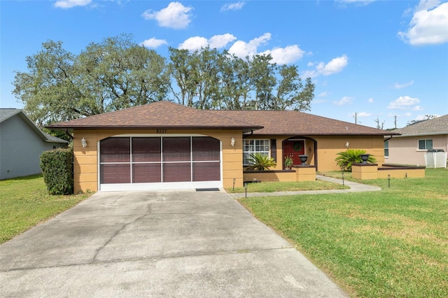 single story home with a front yard and a garage