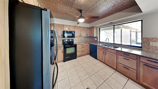 kitchen featuring tasteful backsplash, ceiling fan, sink, and black appliances