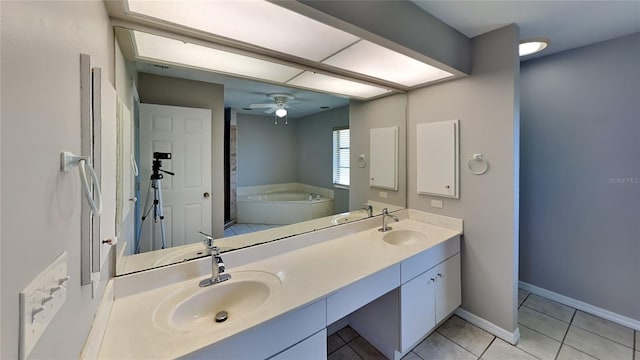 bathroom featuring vanity, tile patterned floors, ceiling fan, and a tub