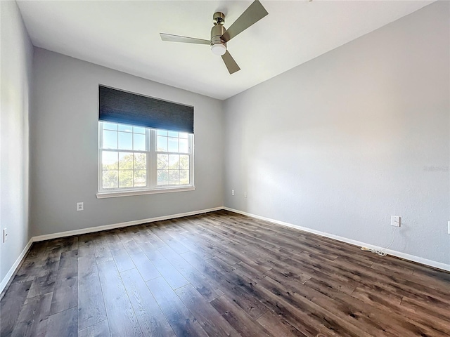 unfurnished room featuring dark hardwood / wood-style floors and ceiling fan