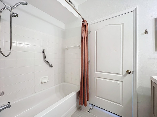 bathroom with vanity and shower / bathtub combination with curtain