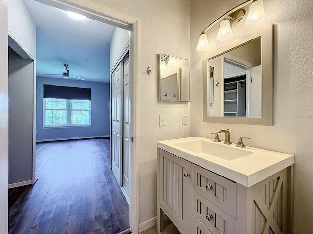 bathroom featuring vanity and hardwood / wood-style flooring