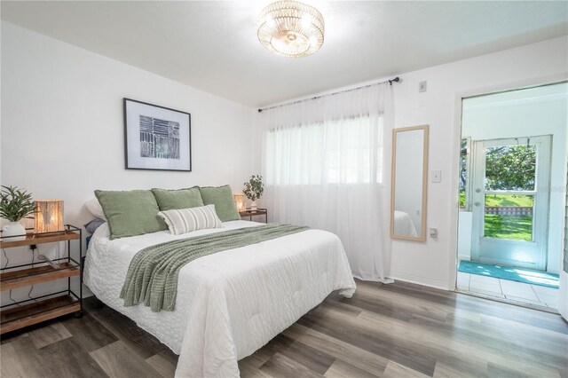 bedroom with hardwood / wood-style floors