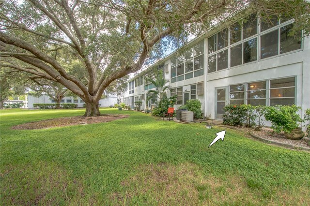 view of yard with central AC