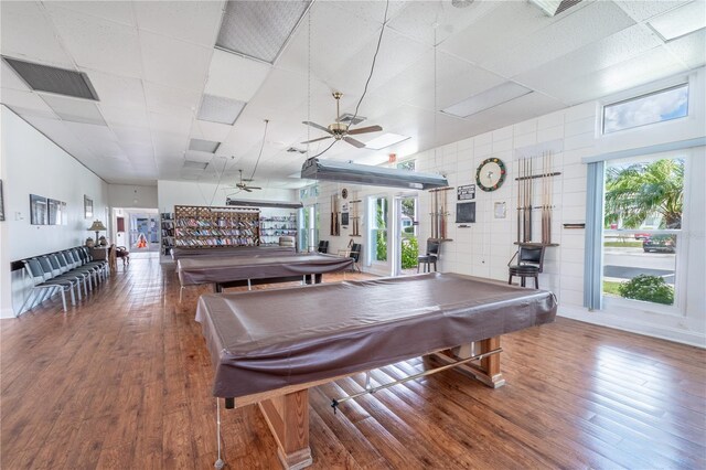 recreation room with hardwood / wood-style floors, pool table, and ceiling fan