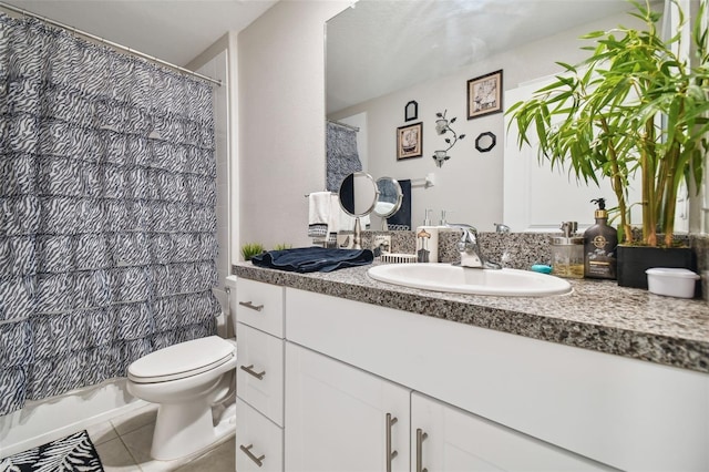 bathroom with vanity, toilet, and tile patterned flooring