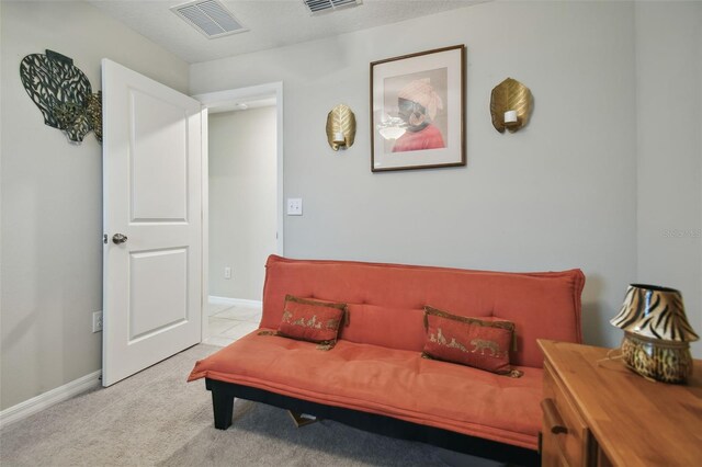 living area featuring light colored carpet