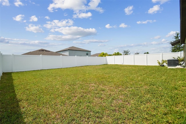 view of yard featuring central AC