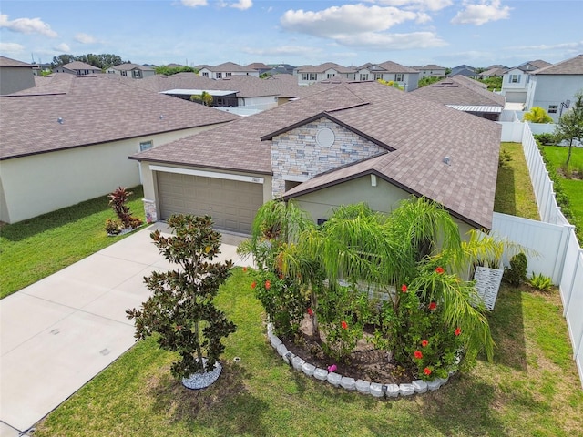 single story home with a garage and a front yard