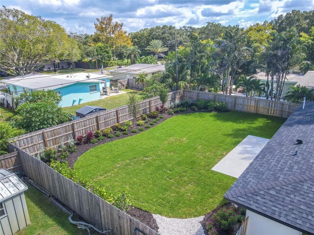 view of yard featuring a fenced in pool and a patio area