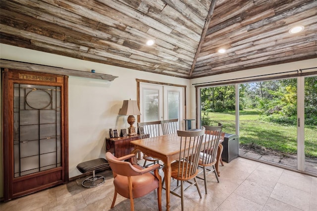 dining space featuring lofted ceiling