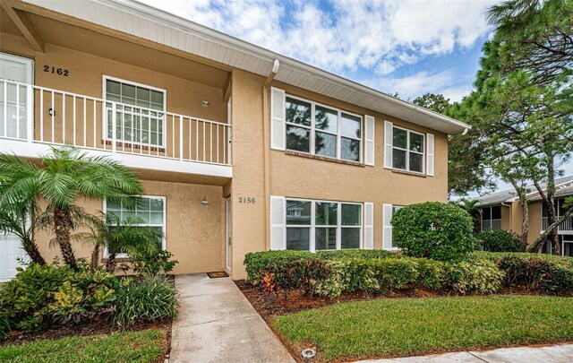 view of front of property with a balcony