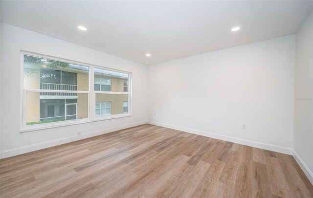 spare room featuring light hardwood / wood-style floors