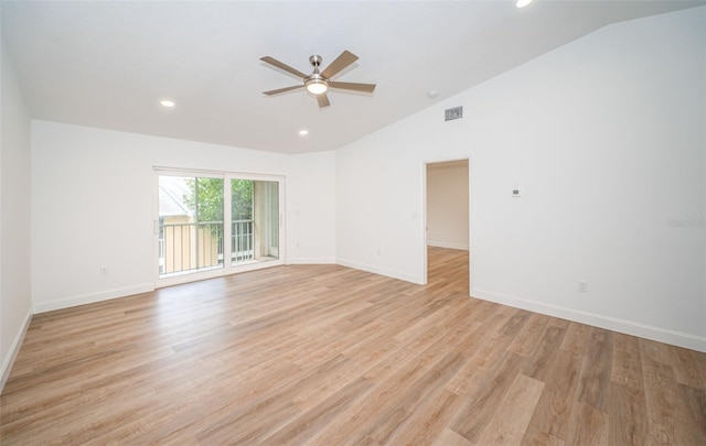 spare room with lofted ceiling, ceiling fan, and light wood-type flooring