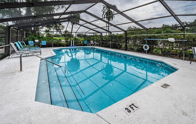 outdoor pool featuring a patio area and a lanai