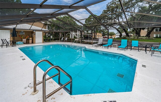 community pool featuring a patio area and a lanai