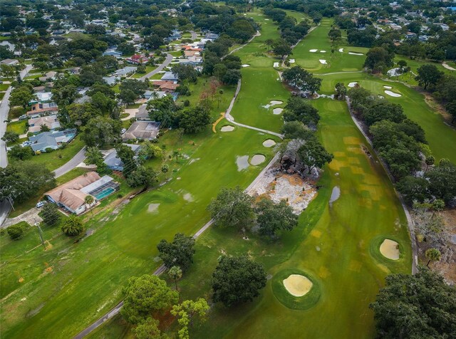 birds eye view of property featuring view of golf course and a residential view