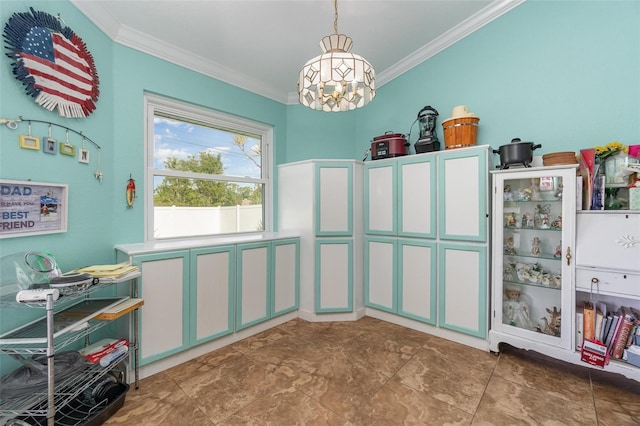 interior space with a chandelier and crown molding