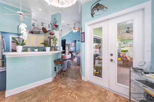 kitchen with ceiling fan, stainless steel fridge, kitchen peninsula, and crown molding