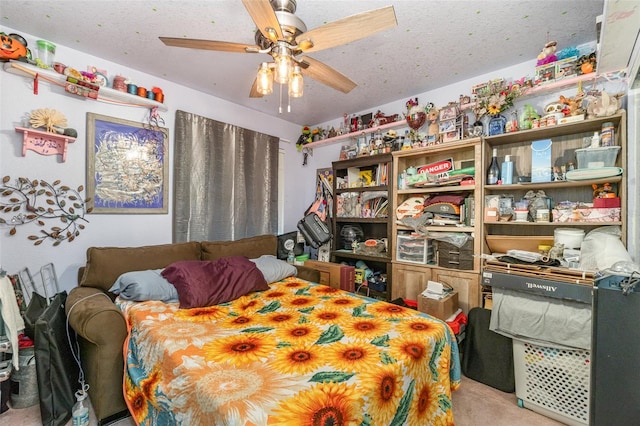 carpeted bedroom featuring a textured ceiling and ceiling fan