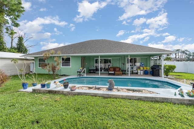 view of swimming pool with a lawn, grilling area, and a patio area