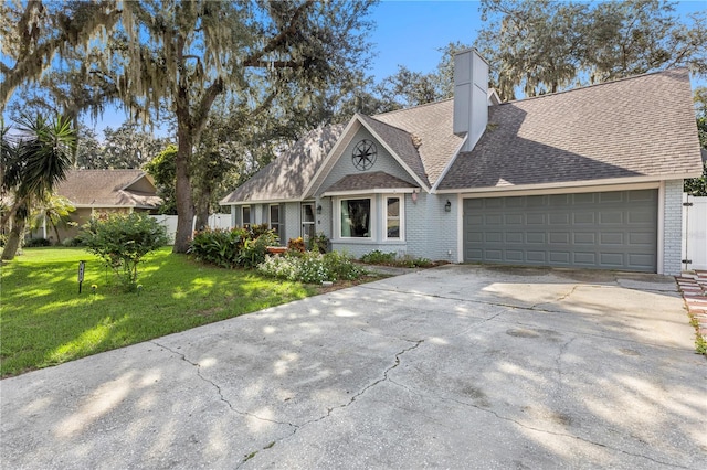 view of front of house featuring a garage and a front yard