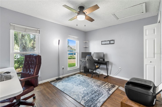 office space with wood-type flooring, ceiling fan, and a textured ceiling