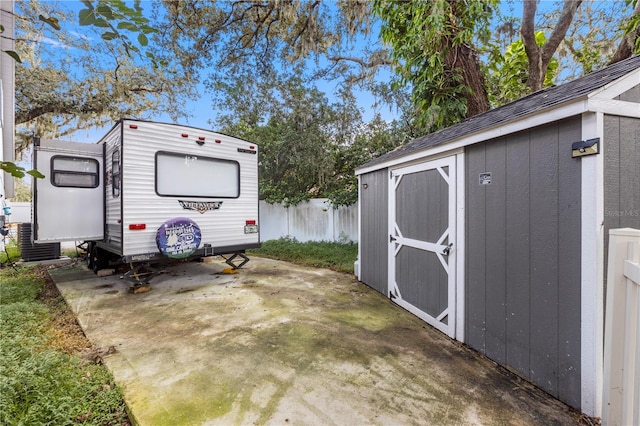 view of patio with a storage unit