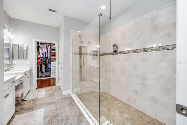 bathroom featuring vanity and walk in shower