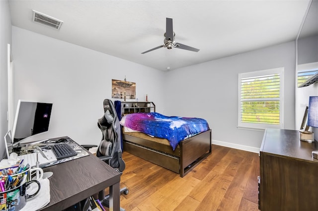 bedroom featuring hardwood / wood-style flooring and ceiling fan