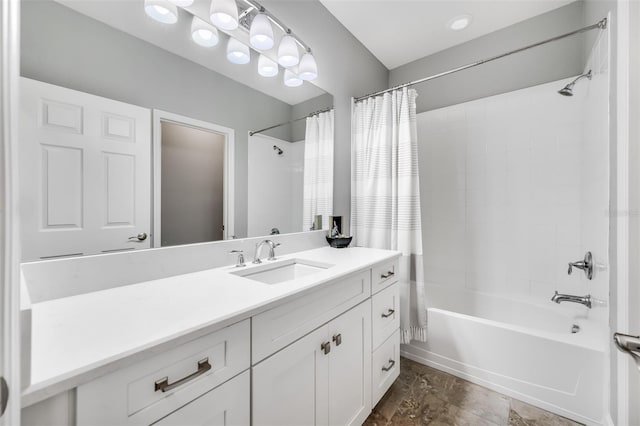 bathroom with shower / bath combination with curtain and vanity