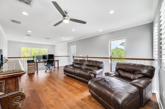 living room with ceiling fan, dark hardwood / wood-style flooring, and crown molding