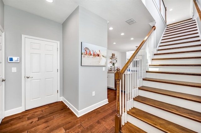 entrance foyer featuring dark hardwood / wood-style flooring