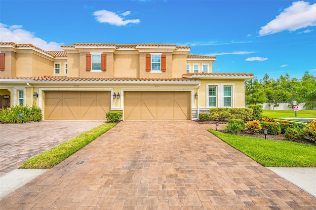 mediterranean / spanish-style home featuring a garage