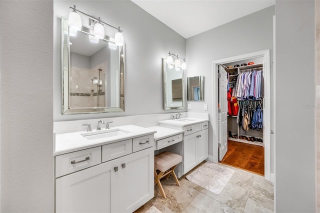 bathroom with walk in shower, hardwood / wood-style flooring, and vanity