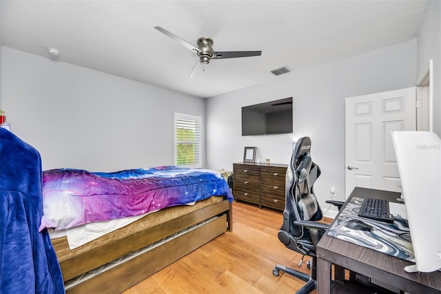 bedroom featuring light hardwood / wood-style flooring and ceiling fan