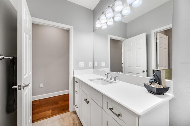 bathroom featuring hardwood / wood-style flooring and vanity