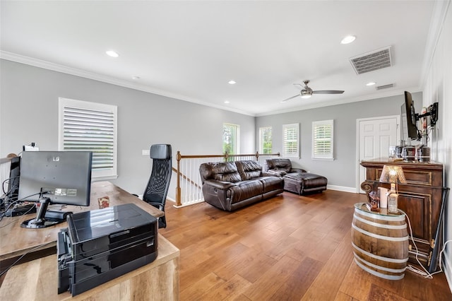 office with wood-type flooring, crown molding, and ceiling fan