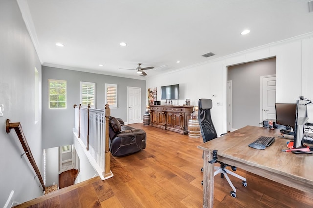 office featuring ornamental molding, hardwood / wood-style flooring, and ceiling fan