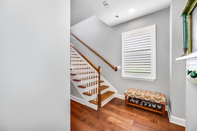 stairway featuring hardwood / wood-style flooring