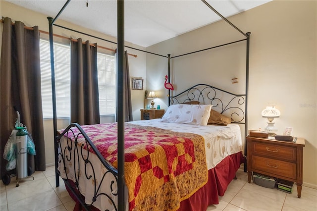 bedroom featuring light tile patterned floors